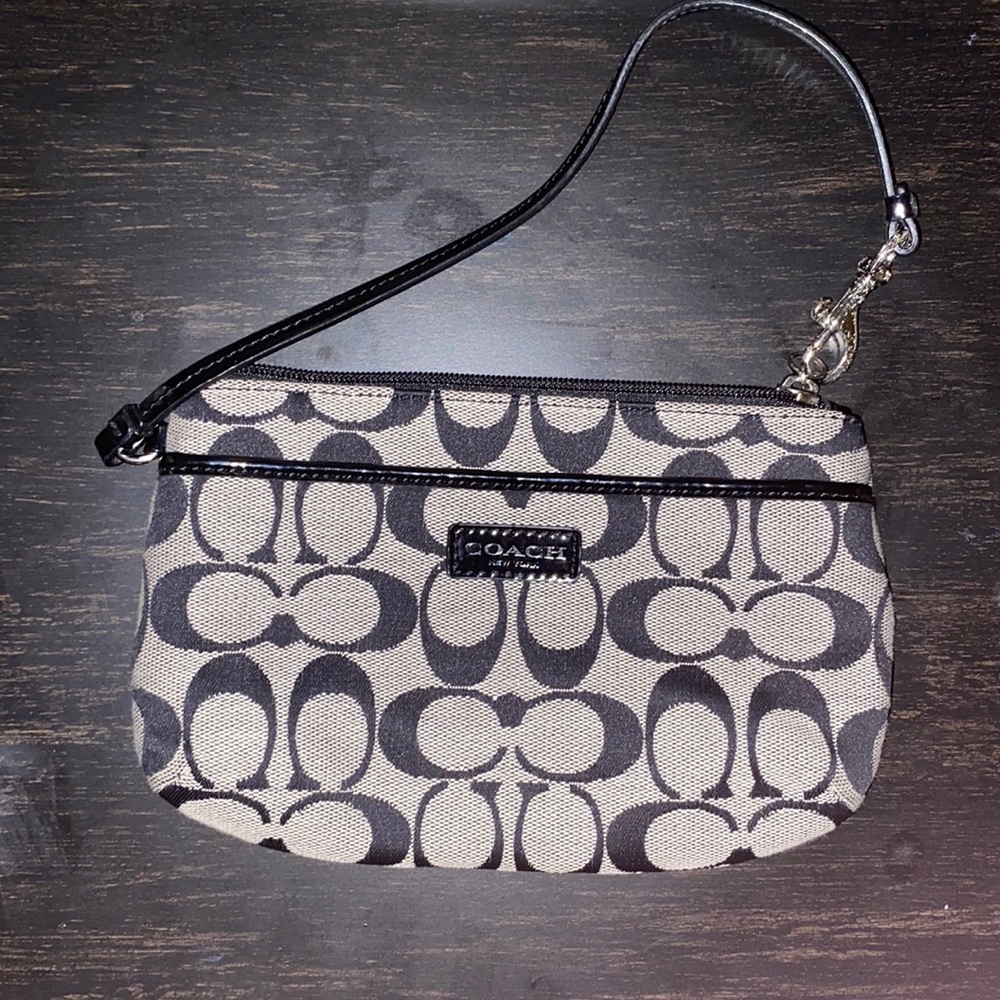 black and grey coach lettering COACH hand bag